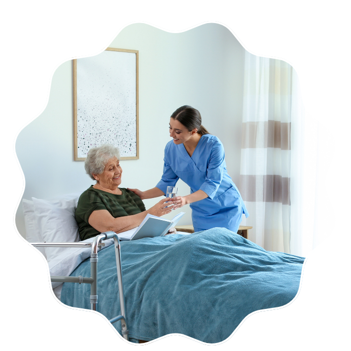 Caregiver assisting a senior woman during post-hospital recovery care at home in Fulton County, GA