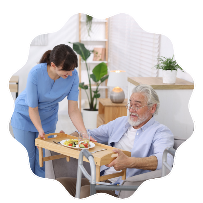 Caregiver assisting a senior man with meal support and personal care services in Fulton County, GA