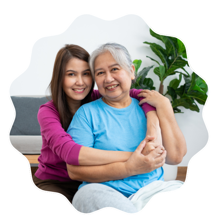 Caregiver embracing a senior woman while providing compassionate in-home care services in Fulton County, GA