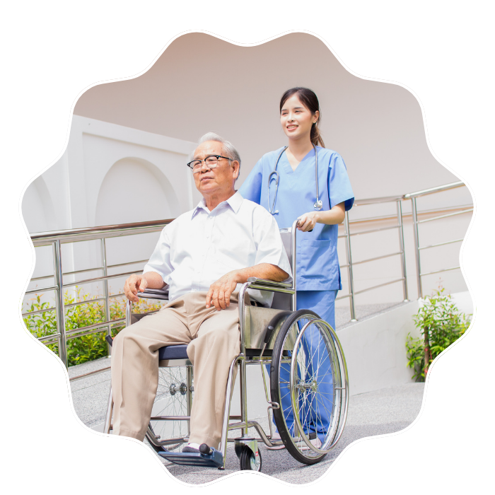 Caregiver assisting a senior man in a wheelchair during respite care services in Fulton County, GA