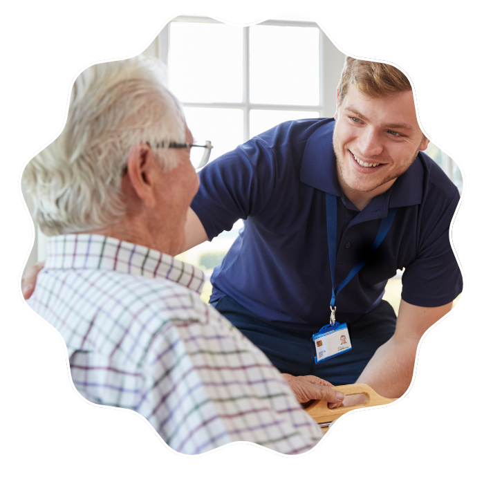 Caregiver providing personalized concierge care support to a senior man at home in Fulton County, GA